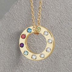 Celebrate the bonds of family with this exquisite Diamond Accented Personalized Birthstone Necklace, crafted from 14K solid gold. The elegant circle pendant can be customized with the genuine birthstones of your loved ones, making it a cherished keepsake for mothers and grandmothers. This necklace is more than just a piece of jewelry--it's a symbol of love, connection, and cherished memories. Gift it to a special woman in your life, or keep it as a beautiful reminder of your own family. ✪ DETAILS  * Offered in 14K Yellow, Rose, and White Gold (Stamped 14K for Purity Authenticity )  and 925 Sterling Silver. * Pendant Dimensions: 12 x 12 mm * Chain: 14K Yellow 1 mm Adjustable Diamond-Cut Cable 16-18" Chain * Weight : 2.53 Grams  * Stone Size: 1.5mm * Diamond Color Clarity: G-H, I1 * Customiz Necklace Mom, Family Circle, Love Connection, Mom Necklace, Circle Necklace, Diamond Color, Circle Pendant, Cherished Memories, Birthstone Necklace