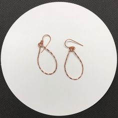 Shiny, lightweight twisted copper teardrop earrings.Approximately 1 1/2" long and 7/8" wideThese earrings have been polished and sealed. Sealed with Protectaclear ProtectaClear is a clear, protective coating that is tough enough to protect jewelry and is safe for wear against skin. ProtectaClear is practically invisible once applied and will seal and protect jewelry from tarnish, oxidation, and corrosion Silver Teardrop Jewelry With Copper Wire, Silver Teardrop Jewelry In Copper Wire, Elegant Teardrop Copper Wire Earrings, Wire Wrapped Copper Teardrop Earrings, Copper Wire Teardrop Earrings, Teardrop Wrap Earrings As Gift, Teardrop Wrap Earrings For Gift, Rose Gold Teardrop Earrings Gift, Nickel-free Copper Wire Teardrop Earrings