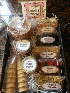 a tray filled with lots of food on top of a counter next to a sign that says just add ice cream