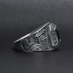 The United States Military Black Stone Women's Army Ring from our Military Collection is custom molded and cast with a premium blend of surgical stainless steel that offers enhanced durability, even after exhaustive wear. The woman's style of the United States Military Black Stone Army Ring is smaller than the men's version but also features a dark black stone centerpiece with detailed sides and "United States Army". This ring is a bulkier-styled ring that is great for women and men who want a c Tarnish Resistant Silver Stainless Steel Rings, Durable Silver Metal Ring, Durable Silver Promise Ring, Adjustable Silver Titanium Rings, Silver Titanium Rings With Polished Finish, Classic Durable Silver Jewelry, Black Stainless Steel Engraved Ring, Black Titanium Jewelry With Polished Finish, Durable Classic Stainless Steel Jewelry