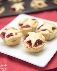 small pastries on a white plate with red table cloth and baking pans in the background