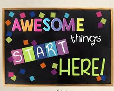 there is a sign that says awesome things start here with colorful blocks on the blackboard