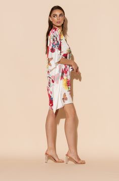 This is one Bouquet you won't want to throw away! Vibrant blooms of flora and fauna adorn this short caftan with tie waist in our signature Polysilk fabric. Dance the night away or lounge in luxe - the occasions are endless with this beautiful, blossoming statement piece. Printed short caftan Can be worn loose or cinched at the waist Comes with a matching belt as an option for styling Lusciously soft poly-silk blend for ease of care Machine wash cool Tumble-dry low Flowy Silk Summer Kimono, Flowy Silk Kimono For Summer, Summer Silk Kimono With Tie Waist, Summer Silk Kimono Flowy Fit, Multicolor Floral Print Sleepwear For Spring, Spring Floral Print Multicolor Sleepwear, Chic Short Sleeve Spring Sleepwear, Spring Multicolor Floral Print Sleepwear, White Silk Sleepwear For Spring