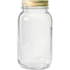 a clear glass jar with a gold lid on a white background for use as a storage container