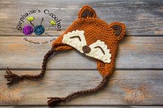 a crocheted hat with a fox's head on it