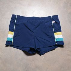 "Great pair of vintage Jantzen trunks. Drawstring waist. Lining has been cut out. Elastic at the waist is pretty much shot, otherwise excellent vintage condition. Labeled as a 34. Best fit for a 36-38. Please see actual measurements below.  Waist: 36-38\" Inseam: 3\" Outseam: 2\" If you would like to see additional photos or have any other questions, please do not hesitate to ask, and thanks for looking! Shipping disclaimer: All domestic orders under 16oz ship USPS Ground Advantage. All domestic orders over 16oz ship USPS priority mail. All international orders under 4lbs ship via Etsy's Global Shipping Program. All international orders over 4lbs ship USPS priority mail. If international buyers wish to have a package that is under 4lbs shipped via priority mail, please contact me before pu Retro Swim Trunks With Built-in Shorts, Sporty Blue Athletic Shorts For Poolside, Sporty Athletic Shorts For Pool, Retro Blue Bottoms For Poolside, Retro Blue Swimwear For Swimming, Retro Blue Swim Bottoms, Retro Blue Swimming Bottoms, Blue Short Swim Trunks For Training, Vintage Blue Swimwear For Swimming