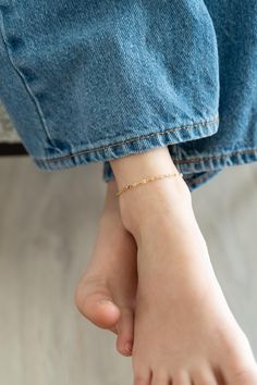 This dainty anklet is the perfect addition to any outfit and is darling during the summertime! These anklets are perfect by themselves or stacked with others. The chain is out of 14k gold filled material. It is hypoallergenic along with water and tarnish resistant. As with any type of jewelry, it is best practice to avoid any harsh chemicals, lotions, oils, sunscreens, etc. to make sure your jewelry stays in the best quality possible. For best fit, please measure before ordering using a string to ensure you purchase the right size. Each anklet comes with a 1 inch extender chain. Average sizing goes as follows: 0-6 Months: 5" 6-12 Months: 5.5" 1-3 Years: 6" 3-6 Years: 6.5" 6-12 Years: 7" Adult XS: 7.5" Adult S: 8" Adult M 9" Adult L: 10" Adult XL: 11" If you have any questions, please feel Casual Anklets With Ankle Strap For Gifts, Casual Ankle Wrap Anklet As Gift, Toddler Jewelry, Dainty Anklet, Gold Anklet, Baby Jewelry, Chain Anklet, Anklet Bracelet, Anklet Jewelry