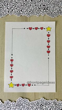 a white paper with hearts and stars on it, next to a doily border