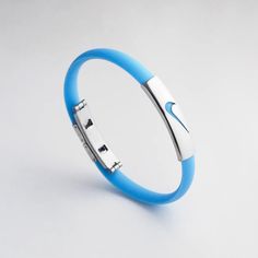 Nike Unisex/Men's Sport Silicone Rubber Wristbands Bracelet,Sky Blue Adjustable Silicone Band & Silver Stainless Steel Clasp. Comes With Metal Container,Brand New. Modern Blue Adjustable Bracelets, Modern Adjustable Blue Bracelets, Adjustable Blue Wristband Gift, Adjustable Blue Band Bracelets, Sporty Blue Bracelet For Sports, Blue Sporty Bracelet For Sports, Modern Adjustable Stainless Steel Wristband, Silicone Bracelets Sports, Adjustable Blue Wristband For Sports