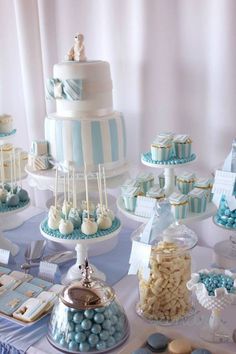 a table topped with lots of blue and white desserts