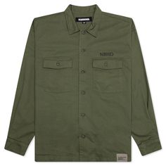 The Neighborhood BDU Shirt L/S makes an impression with its military aesthetic. Composed of cotton, the shirt features a full button-closure at the front. Two chest pockets, a pointed collar, and button cuffs add to the design. The branded woven tag at the hem and screen-printed details wraps up the silhouette. 100% Cotton Button closure Pointed collar Chest pockets Woven tag Button cuffs Style No: 241TSNH-SHM09-OD Military Style Button-up Work Shirt, Military Style Button-up Shirt For Work, Military Style Workwear Button-up Shirt, Military Style Collared Shirt For Workwear, Military Style Shirt For Work With Button Closure, Military Style Shirt With Buttons For Work, Military Style Workwear Shirt With Buttons, Military Button-up Shirt, Military Style Button-up Shirt With Pockets