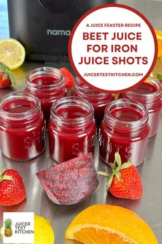 beet juice for iron juice shots with oranges and strawberries on the side