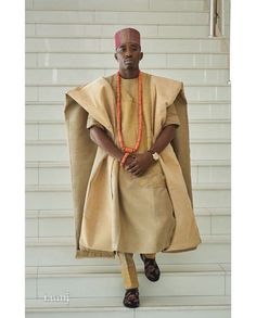 This elegant outfit is handmade with love. The Agbada outer wear is made with Aso oke fabric while the inner shirt and pant is made with quality cotton fabric following high tailoring standards. It is suitable for all kinds of occasion especially African traditional wedding. The pant is styled with either rope, joggers style or elastic band for wearer's ease We also recommend that you provide your measurements in the following manner to ensure a perfect fit. Around neck Shoulder to waist Across shoulder Arm/sleeve length Chest dimension Waist Thigh Hip Waist to ankle Inseam  Height As soon as your order is received and your measurement is provided we start working on it and get it ready in a very short time and ship it through DHL express which delivers within 3-5 business days. If you hav Aso Oke Agbada Styles Men Gold, Agbada Styles Men, African Aesthetic, Agbada Design, African Men Clothing, Nigerian Culture, Dashiki For Men, Luxurious Mansion, Mens Wedding Attire