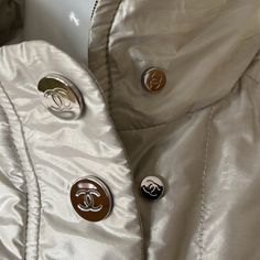 Authentic Chanel, The Best Ever Made By Chanel 5 In 1 Versatile Jacket Coat. Wear It 5 Different Ways Reversible. (1) Blue Black Silver On Top. (2) Metallic Goldish/Silver On Top. Zip Out To 2 Pieces.(3)Where Each Piece Alone.(4)Where Only The Metallic Alone With Cc All Over Snaps Big & Small. & Big Appliqu Stitch Cc In Back, Or.(5) Hide Cc When You Want To Be Low-Key Lol. The Black/Blue Is Brand New Never Worn. The Metallic Gold/Silver Worn Only A Couple Of Times It Does Very Well In Delicate M Luxury Fall Outerwear With Snap Buttons, Luxury Spring Outerwear With Button Closure, Designer Winter Outerwear With Covered Buttons, Luxury Fall Outerwear With Covered Buttons, Designer Spring Outerwear With Covered Buttons, Chanel 5, Versatile Jacket, Chanel No 5, Chanel Jacket