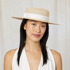 Natural vented hemp boater with ivory textured ribbon band. 6.5" X 2.75" X 3.25" SKU: 21018-13324 Chic Cream Boater Hat With Wide Brim, Chic Cream Wide Brim Boater Hat, Chic White Boater Hat With Flat Brim, Elegant Cream Panama Hat In Straw, Elegant Cream Panama Hat Made Of Straw, Elegant Cream Straw Panama Hat, White Straw Boater Hat With Wide Brim, Spring Beige Fedora With Flat Crown, Beige Fedora With Flat Crown For Spring