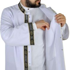 Elegant Prayer Jubba, lightweight and traditional looking will be a great use for Ramadan, Eids, Mawleed, Graduations, Wedding, Engagement or Daily Prayers ◦ Color: White ◦ Style: Bordered ◦ Material: Cotton&Polyester A gorgeous jubbah that will bring you to the forefront with the special bordered embroidery details. A perfect jubbah model for muslim mens who cares about their appearance and have a great taste and style. ✤ Features ✤ * Dominant collar * Traditional Ottoman Style * The edges Ottoman Styling, Muslim Dress, Designer Suits For Men, Plain Black, Embroidery Details, White Style, Designer Suits, Mens Suits, Lab Coat