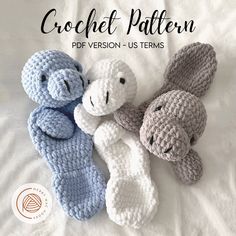 three crocheted stuffed animals laying next to each other on top of a bed