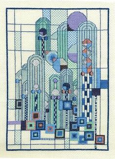 a cross stitch pattern with an image of a building in blue and green colors on it