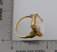 This is a 10K YG Cameo ring, Octagonal Shell cameo with decorations on sides, Circa 1930's, ring size 6, weight 3.5 grams, Nice vintge piece. Excellent condition. Stock #BB68R13 Cameo Rings, Cameo Ring, White Band, Boston Ma, Blue Topaz Ring, Topaz Ring, Pink Tourmaline, Blue Topaz, Gold Diamond