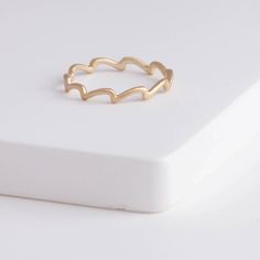 Description 10k yellow gold ring inspired by wavelets. The smooth waves that’s near the shore, the heave of sea on a rainy day, and the splashes created when an animal jumps out of the water are all inspiration of this wave collection. This elegant matte finished ring’s simple and clean look fits every occasion alone, or in your favorite ring stack. Details Gold band - Approximately 2mm from point to bottom (0.75mm band)10k Yellow Gold Made in Japan *This can be ordered to size. Please let us kn Everyday Yellow Gold Wavy Jewelry, Minimalist Yellow Gold Wavy Ring, Minimalist Wavy Yellow Gold Ring, Everyday Wavy Yellow Gold Jewelry, Wavy Stackable Rings, Minimalist 14k Gold Wavy Ring, Gold Wavy Promise Ring, Wavy 14k Gold Rings, Minimalist Wavy Yellow Gold Jewelry