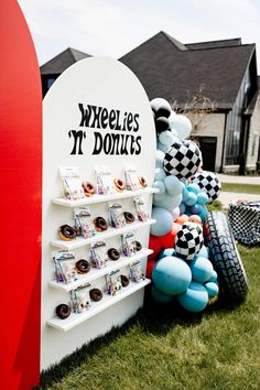 there is a sign that says wheels it donuts on the side of the road