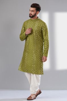 Mehendi green kurta in silk base with intricate mirror work  Components: 1 Pattern: Embroidery Type Of Work: Mirror Work Neckline: Mandarin Collar Sleeve Type: Long Sleeves Fabric: Silk, Lining: Cotton Color: Green Other Details:  Attached cotton lining Side slits Note: The dhoti pant worn by the model is not for sale Occasion: Mehendi and Puja - Aza Fashions Mehndi Clothes For Men, Gents Party Wear Men's Fashion, Mehandi Outfits For Men, Mehendi Function Outfit, Mirror Work Kurta For Men, Haldi Function Dress, Mehandi Function, Mens Dresses