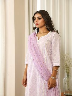 Beautiful handcrafted straight kurta pants set with lace details in pure cotton with lovely matching cotton doriya dupatta that is rightly finished with mirror embroidery. Color: Lavender Fabric: Cotton and Kota Doria Note: Length and sizes can be customised Length - Kurta 40 inches Pants 38 inches Available in other colors If you happen to see some deformity in hand-work or fabric, that’s mere the technique of the same and not a defect. The garment is quite premium. The product will be delivere Designer Purple Palazzo Set With Chikankari Embroidery, Purple Cotton Silk Kurta With Resham Embroidery, Purple Resham Embroidery Cotton Silk Kurta, Traditional Cotton Kurta With Sheer Dupatta, Cotton Sharara With Sheer Dupatta For Festivals, Festive Cotton Palazzo Set With Sheer Dupatta, Cotton Lawn Suit With Sheer Dupatta In Saree Style, Cotton Sets With Sheer Dupatta For Festivals, Cotton Palazzo Set With Sheer Dupatta For Navratri