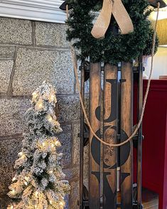 a wooden sled with a christmas wreath on top