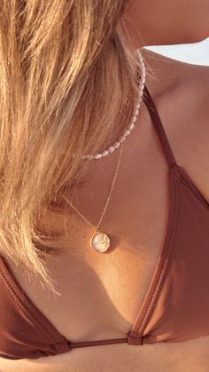 Stunning gold sun and natural shell pendant on a gold plated or gold filled chain. Necklaces are 16 inches in length with a 2 inch extender. Dainty 14k Gold Filled Medallion Jewelry, Dainty 14k Gold-filled Medallion Jewelry, Rose Gold 14k Gold-filled Necklace With Pearl Pendant, 14k Rose Gold Filled Necklaces With Pearl Pendant, Gold Charm Necklaces With Pearl Pendant, Dainty 14k Gold Filled Charm Necklace With Pearl Pendant, Dainty Medallion Necklace In 14k Gold Filled, Dainty Gold Shell Necklace, Adjustable 14k Gold-filled Rose Gold Necklace