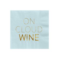 a napkin with the words on cloud wine written in gold foil over light blue paper