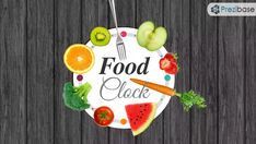 a plate with fruits and vegetables on it that says food clock next to an apple, carrots, watermelon, kiwi, apples, broccoli, cucumber