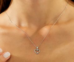 14K SOLID WHITE GOLD DAINTY HEART NECKLACE WITH NATURAL DIAMONDSHere is a dainty, delicate and simple, yet classy minimalist Heart Necklace. This is 14k Solid Gold. (We do not sell filled or plated jewelry) Perfect for everyday use.Necklace Length : 16 inches Heart Height : 13.50mmHeart Width : 10mmDiamond : 1 Diamonds --- Nice White Color Sparkle Diamonds ---- G color VSI clarityTotal Carat : 0.02ct ---MADE IN USA--- Diamond Cut Heart Necklace, Formal Heart Cut Necklace For Mother's Day, Fine Jewelry White Gold Heart Necklace With Birthstone, Round Cut Jewelry With Heart Charm For Valentine's Day, White Gold Heart Necklace With Birthstone, Heart Necklace Round Cut As Gift, Gift Heart Necklace With Round Cut, Valentine's Day Heart Cut Diamond Necklace, White Gold Heart Charm Jewelry With Round Cut