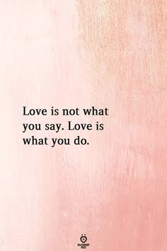 a pink wall with the words love is not what you say, love is what you do