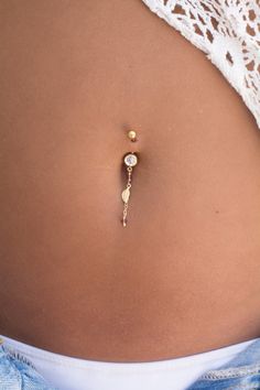 "A beautiful belly button ring that will complete your summer festival look with boho-chic style. The barbell is made of surgical steel, a tiny leaf pendant made of 14k goldfilled and 2 light purple Swarovski crystal beads are dangling from the bottom barbell with a dainty goldfilled chain, to create a delicate yet bold piece of body jewelry. Do not hesitate to contact me for special requests and customization! ♥♥ ▶ Surgical steel curved barbell, 11 mm long (not including the barbells) for a uni Belly Percinings, Piercing Navel, Jewelry Beauty, Bellybutton Piercings, Belly Button Piercing Jewelry, Belly Piercing Jewelry, Rings Boho, Button Piercing, Cute Piercings