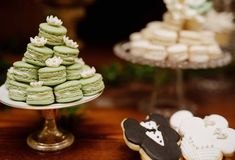 there are many different types of cookies on the table and one is decorated like a christmas tree