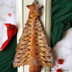 a pastry shaped like a christmas tree on a plate