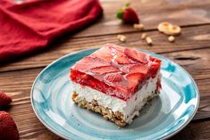 a piece of cake on a plate with strawberries