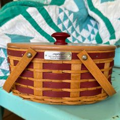 a wooden basket sitting on top of a blue table