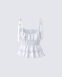 Add some subtle playfulness to your closet with this white ruffle tie top 🌟 With a fun and flirty design, this top made from a blend of cotton poplin and lace fabric and complete with a smocked waistband is the perfect staple for all our baddies with a sweet side 🤍 Feminine White Smocked Top For Brunch, Feminine Cotton Tops With Lace Patchwork, White Cotton Lace Summer Tops, Chic Summer Cotton Lace Top, Elegant Tops With Lace Trim And Ruffled Straps, Sleeveless Cotton Lace Top With Ruffles, Summer Lace Top With Ruffles, White Lace Patchwork Cotton Top, Feminine White Cotton Lace Top