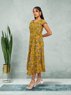 Embrace elegance with our Tranquil Threads yellow knee-length dress. Featuring a stunning print, this dress is perfect for everyday wear or a night out in the city. Crafted with care for the modern woman who values both comfort and style. Key Specifications : Material Kalankari Silk Occasion Casual Type Fusion/Indowestern Knee-length Printed Sundress, Printed Flowy Midi Dress, Flowy Printed Midi Dress, Printed Fitted Knee-length Sundress, Fitted Knee-length Printed Sundress, Yellow Floral Print Midi Dress, Yellow Fitted Midi-length Dress, Casual Yellow A-line Midi Dress, Printed Sundress In Midi Length