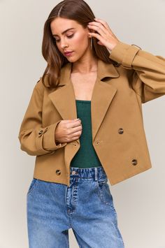 Short trench coat, ends at the waist. Front button closure. Sleeve buttons. Material: 100% Cotton MODEL IS WEARING A SIZE SMALLMODEL SPECSHEIGHT: 5'8"BUST: 32AWAIST: 24"HIPS: 34" Cropped Trench Coat, Short Trench Coat, Cozy Knits, Denim Pant, Hat Hairstyles, Sweater Jacket, Bottoms Pants, Short Outfits, Casual Tops