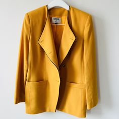 Vintage Golden Yellow Asymmetrical Button Blazer By Kasper For Asl Nwt Black Trim Piping Detail Subtle Shoulder Pads Size 14 Deadstock Material: 100% Wool Lining: 100% Acetate Aprx Flat Meas: Bust 22.5" Waist 20" Length 30" Sleeves 24.5" See Last Pic For Minor Flaw Kept In A Clean, Smoke-Free, Pet-Free Environment Tailored Yellow Outerwear For Office, Yellow Spring Office Blazer, Yellow Notch Lapel Outerwear For Office, Yellow Notch Lapel Blazer For Work, Tailored Yellow Outerwear For Formal Occasions, Tailored Yellow Formal Outerwear, Classic Yellow Blazer For Office, Classic Yellow Outerwear With Lapel Collar, Tailored Long Sleeve Yellow Blazer