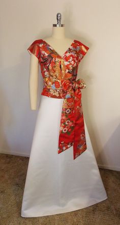 "V-neck / French sleeve dress top and OBI sash with vintage red wedding KIMONO UCHIKAKE gold brocade. Gorgeous woven patterns of phoenix and flowers. Size--- US8~10 *Please refer to finished garment measurement. *The mannequin on the picture is US8. Finished garment measurements; Bust-38 1/2\" (98cm Waist-31 1/2\" (80cm Middle Hip-42 1/2\" (108cm Shoulder-13 3/5\" ~ 14 1/2\" (35~37cm) Sleeve-3\"~ 4\" 8~10cm              * This style would be nice for a loose fit as well              * The final Fitted Silk V-neck Kimono, Elegant Fitted Kimono With Floral Print, V-neck Kimono For Wedding, Elegant Red Kimono For Wedding, Traditional Fitted Kimono For Wedding, Traditional Fitted Wedding Kimono, Spring Wedding Satin Kimono, Vintage Red Wedding, Kimono Obi