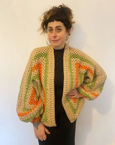 "Our lovely cosy knitwear is hand knitted by our team in the UK. Each one has its own unique colour and pattern and no two are the same.  Our knitwear is created from mixed wool using left over pieces from our other projects and follows our zero waste aesthetic. This includes wool and acrylic fibres. This beautiful sweater has cropped balloon style sleeves and squares of crochet. Oversized for that slouchy, cosy feel! We also make to order.. please contact us if you have a particular colour way in mind! MEASUREMENTS (approximate) Pit to pit unstretched laid flat 30\" Length shoulder to hem 27\" Length of sleeve from neckline 27\" CARE INSTRUCTIONS Handle as delicate cool wash Dry flat Do not tumble dry" Spring Cozy Sweater In Acrylic Yarn, Cozy Acrylic Yarn Sweater For Spring, Bohemian Chunky Knit Brown Sweater, Bohemian Brown Chunky Knit Sweater, Multicolor Oversized Open Knit Sweater, Oversized Multicolor Open Knit Sweater, Beige Crochet Knit Cardigan, Handmade Knit Cardigan In One Size, Handmade Knit One-size Cardigan