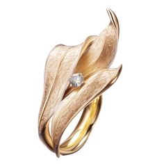 This contemporary Lily of The Valley Engagement Ring is made of 18 karat yellow gold and one round diamond. It has a sculptural shape. We use top colour natural diamonds, VS, 0,18 carats. We work with German gems companies that have been in business since the 19th century. The ring can be personalised with a name or a saying. Please allow us time to customize the ring. The ring can be ordered as usual fashion ring. The size and the colour of the gold can be changed. Rose Diamond Ring, Neck Pieces Jewelry, Art Nouveau Ring, Ring Jewellery Design, Contemporary Jewelry Design, Jewels Rings, Contemporary Ring, Leaf Jewelry, Couture Jewelry