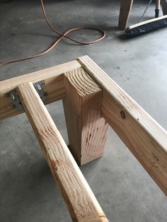 the wooden frame is being built to be used as a bench