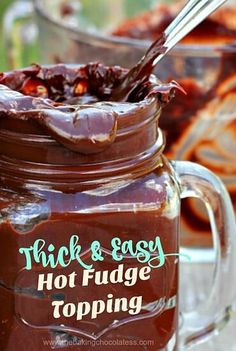 a jar filled with hot fudge topping on top of a table