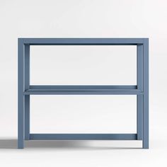 a blue shelf sitting on top of a white floor