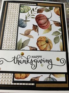 a close up of a thanksgiving card with leaves and acorns on the front