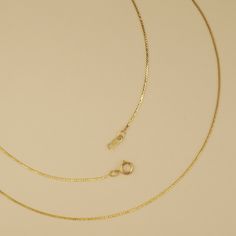 A very fine serpentine chain. This is best when paired with very small charms. Comes in 925 sterling silver or gold filled. Spring ring clasp. 1mm link width. Delicate 14k Gold Curb Chain Jewelry, 14k Gold Dainty Curb Chain Jewelry, Gold Sterling Silver Snake Chain Charm Necklace, Dainty Sterling Silver Jewelry With Curb Chain, Delicate Gold Jewelry With Curb Chain, Gold Sterling Silver Curb Chain Necklace, Dainty Charm Necklaces With Curb Chain For Gifts, Delicate Yellow Gold Snake Chain Necklace, Minimalist Sterling Silver Curb Chain Jewelry